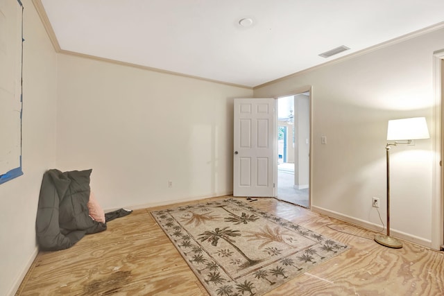 unfurnished room with crown molding and hardwood / wood-style floors