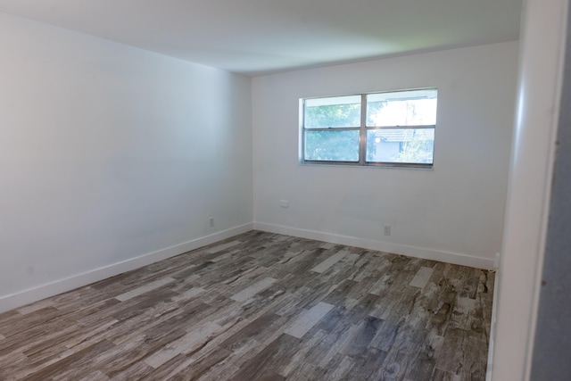 empty room featuring dark wood-type flooring