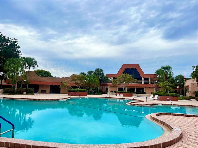 view of swimming pool with a patio