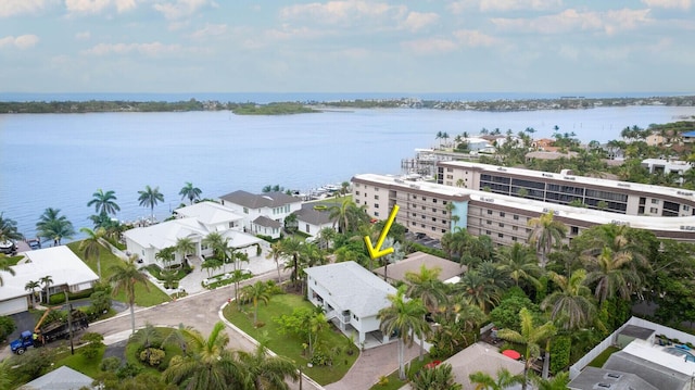 birds eye view of property featuring a water view