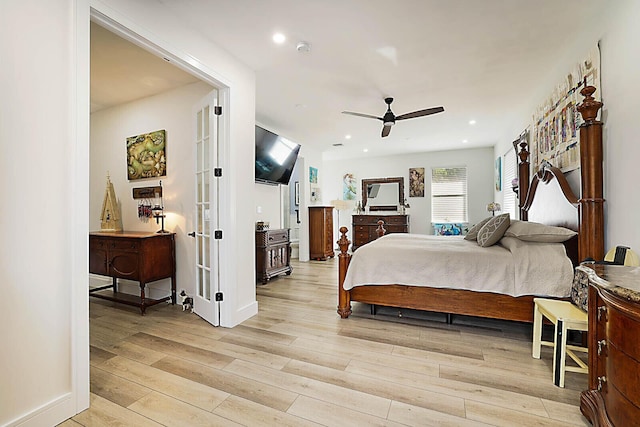 bedroom with ceiling fan and light wood-type flooring