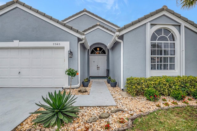 entrance to property featuring a garage