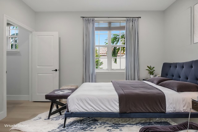 bedroom with light hardwood / wood-style flooring