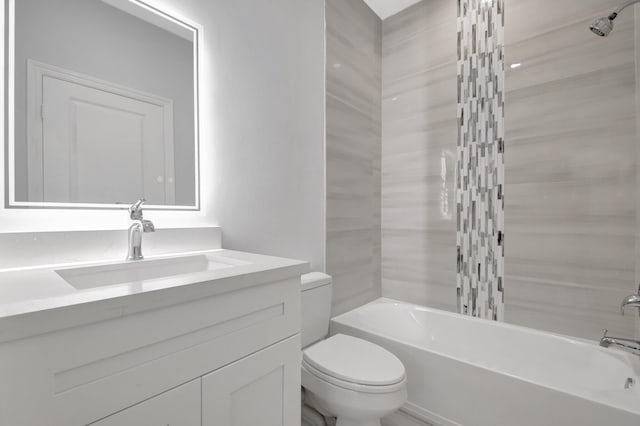 full bathroom featuring bathing tub / shower combination, vanity, and toilet