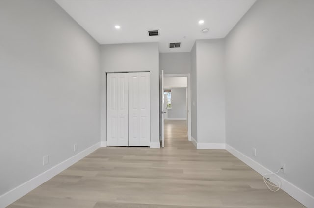 interior space featuring a closet and light wood-type flooring