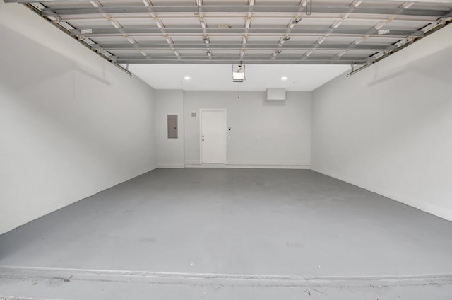 garage featuring a garage door opener and electric panel