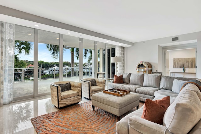 living room featuring a wall of windows