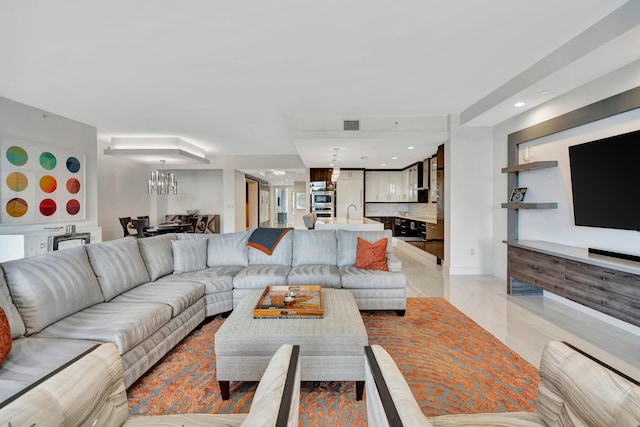 living room featuring a chandelier