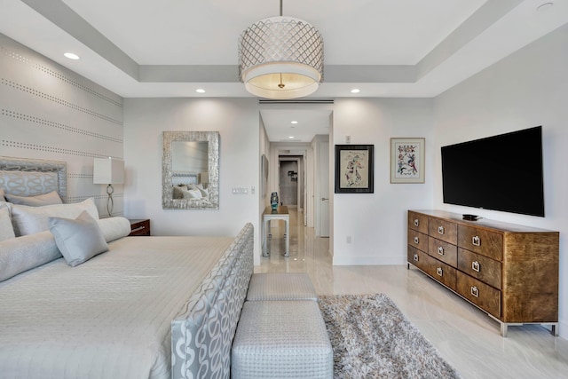 bedroom featuring a raised ceiling