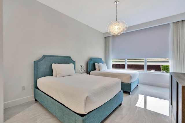 bedroom with a notable chandelier and vaulted ceiling