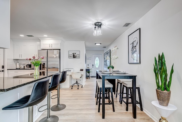 dining room with light hardwood / wood-style flooring