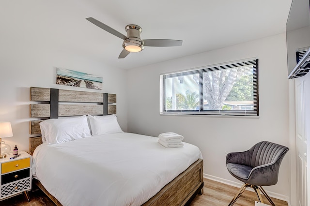 bedroom featuring ceiling fan and hardwood / wood-style flooring