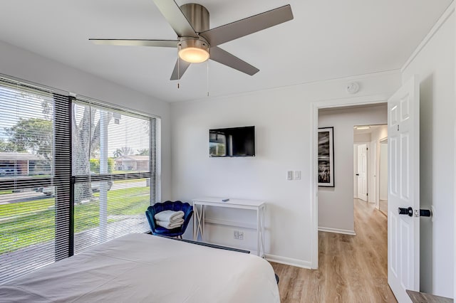 bedroom featuring ceiling fan and light hardwood / wood-style flooring