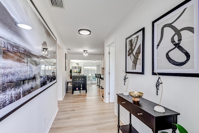 corridor with light hardwood / wood-style flooring