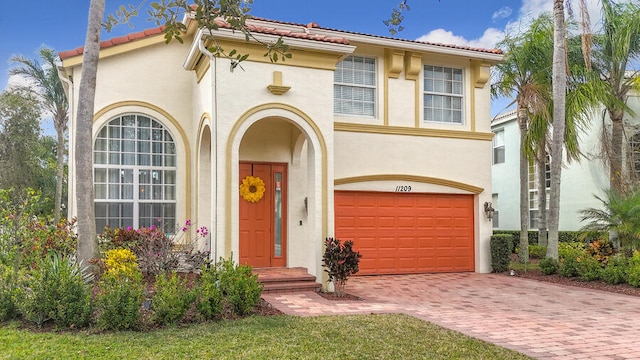 mediterranean / spanish-style home featuring a garage