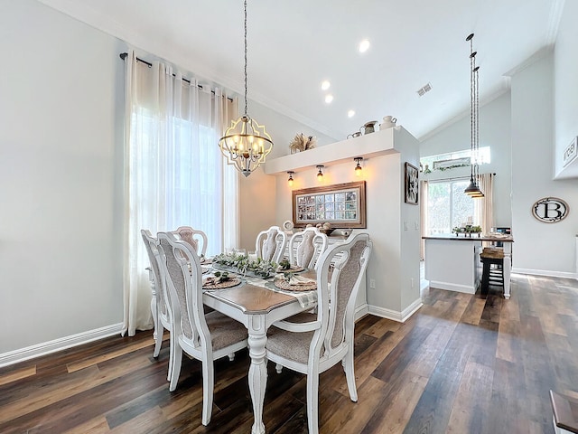 dining space featuring vaulted ceiling, dark hardwood / wood-style flooring, an inviting chandelier, and ornamental molding