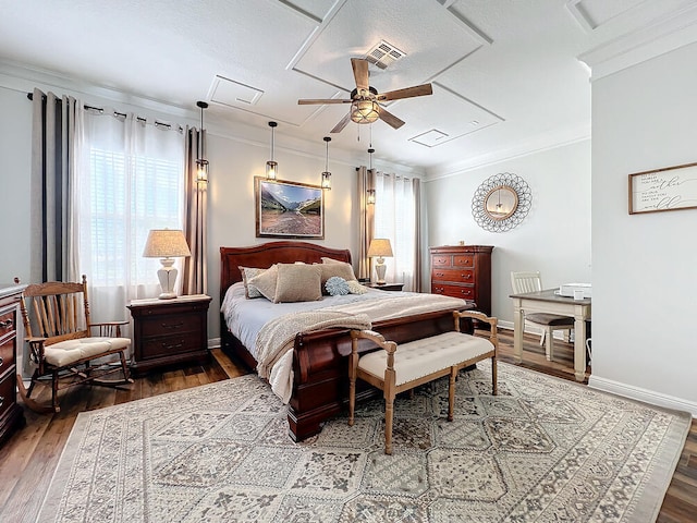 bedroom with ceiling fan, wood-type flooring, and ornamental molding