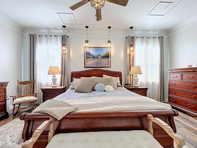 bedroom featuring crown molding and hardwood / wood-style flooring