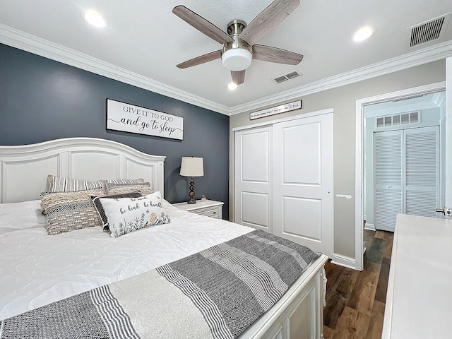 bedroom featuring ceiling fan, dark hardwood / wood-style flooring, and ornamental molding