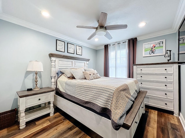 bedroom featuring ceiling fan, dark hardwood / wood-style floors, and crown molding