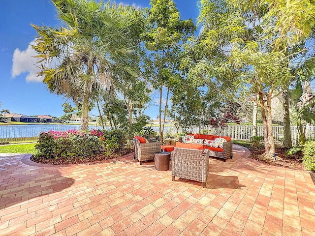 view of patio / terrace with a water view and an outdoor hangout area