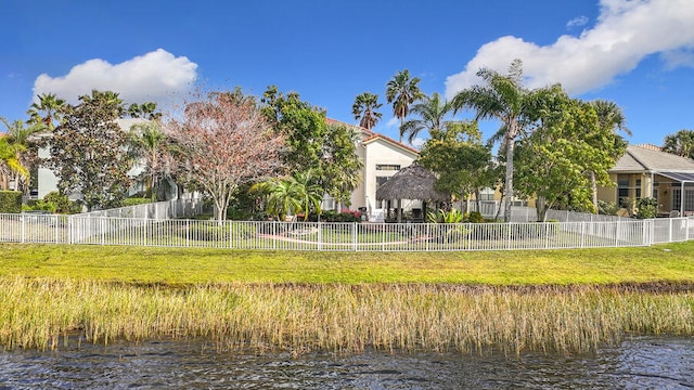 view of yard featuring a gazebo and a water view