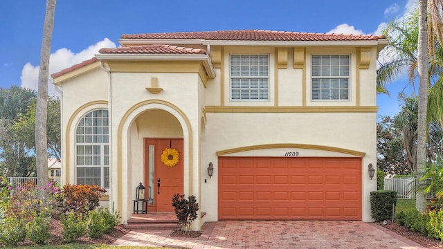 mediterranean / spanish house featuring a garage