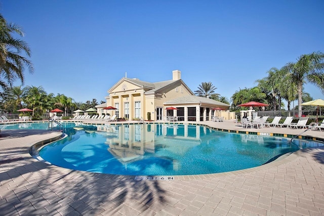 view of swimming pool featuring a patio area