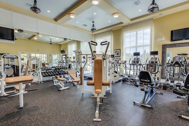 workout area with a towering ceiling