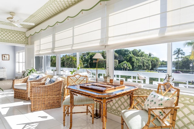 sunroom / solarium featuring ceiling fan