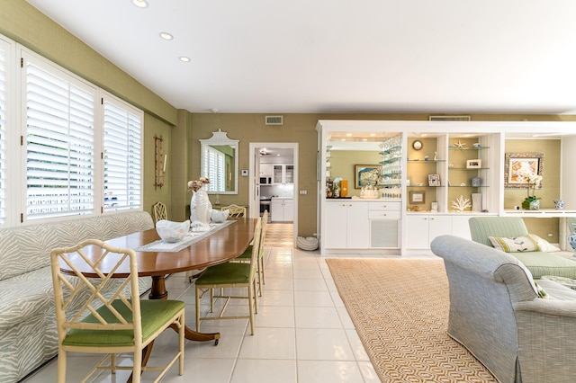 dining area featuring light tile patterned flooring