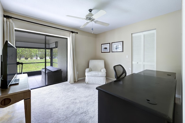 office area with ceiling fan and light colored carpet