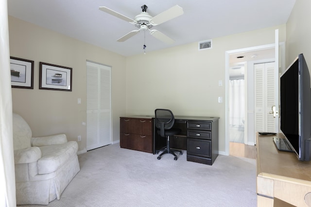 office area featuring ceiling fan and light colored carpet