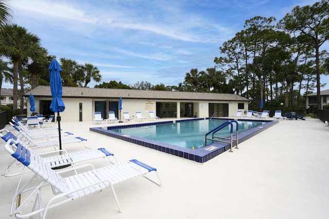 view of swimming pool with a patio area