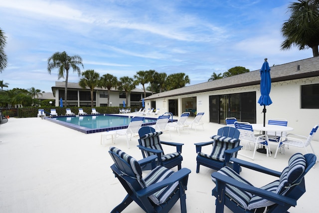 view of swimming pool with a patio area