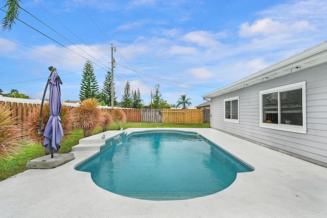 view of swimming pool featuring a patio area, a fenced backyard, and a fenced in pool