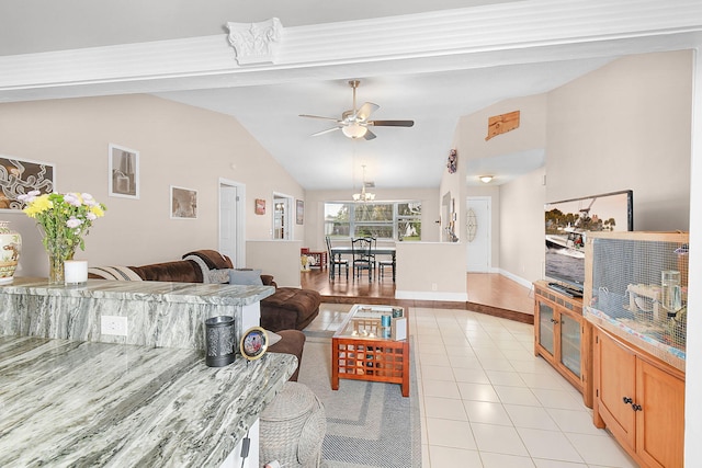 living room with lofted ceiling, light tile patterned floors, and ceiling fan