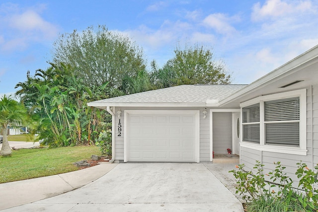 garage with a yard