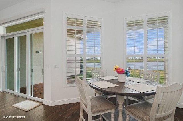 dining area with dark wood-type flooring