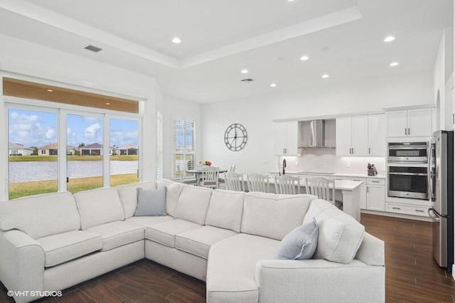 living room featuring a water view