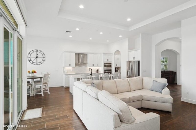 living room with a raised ceiling