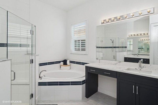 bathroom featuring vanity, tile patterned flooring, and plus walk in shower