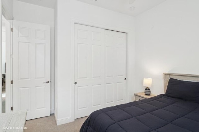 carpeted bedroom with a closet