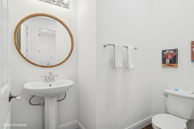 bathroom with toilet and sink