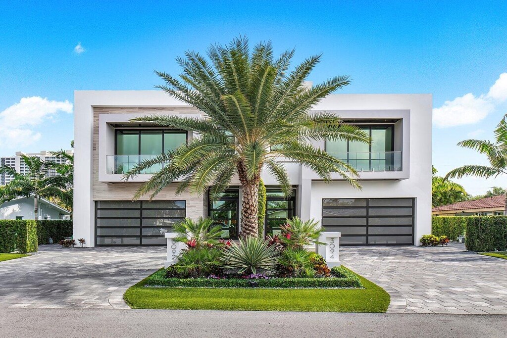 contemporary home with a balcony and a garage