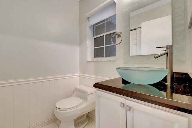 bathroom with toilet and vanity