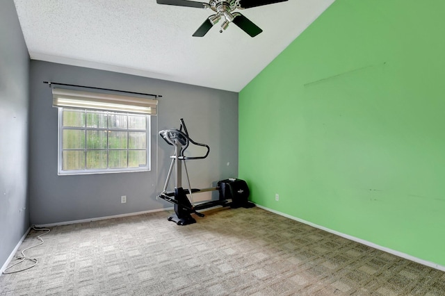 workout area featuring a textured ceiling, ceiling fan, lofted ceiling, and light colored carpet