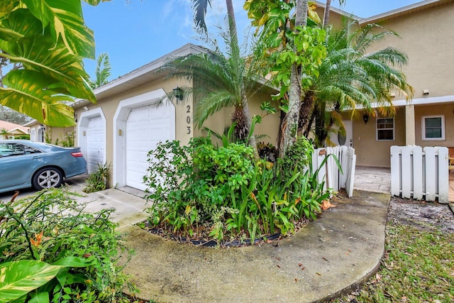 view of side of home with a garage