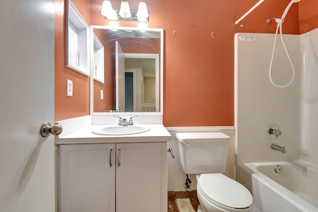 full bathroom featuring toilet, vanity, and bathing tub / shower combination