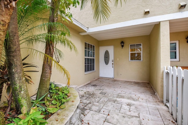 property entrance with a patio